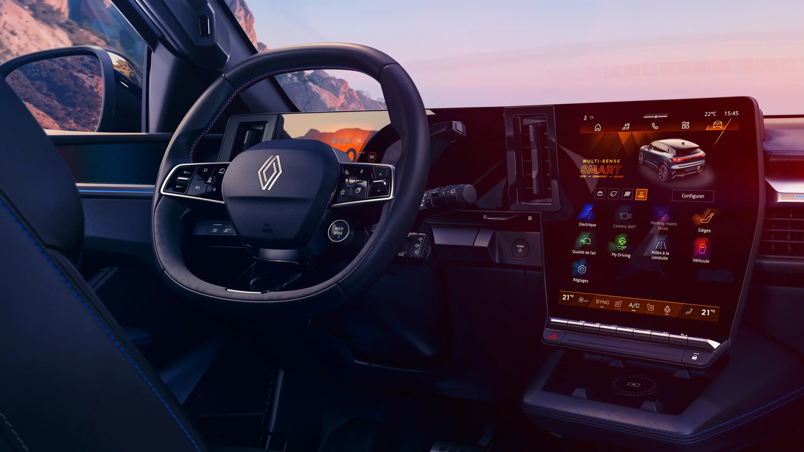 Interior do Renault Megane E-Tech com volante e ecrã multimédia openR link de 12 polegadas