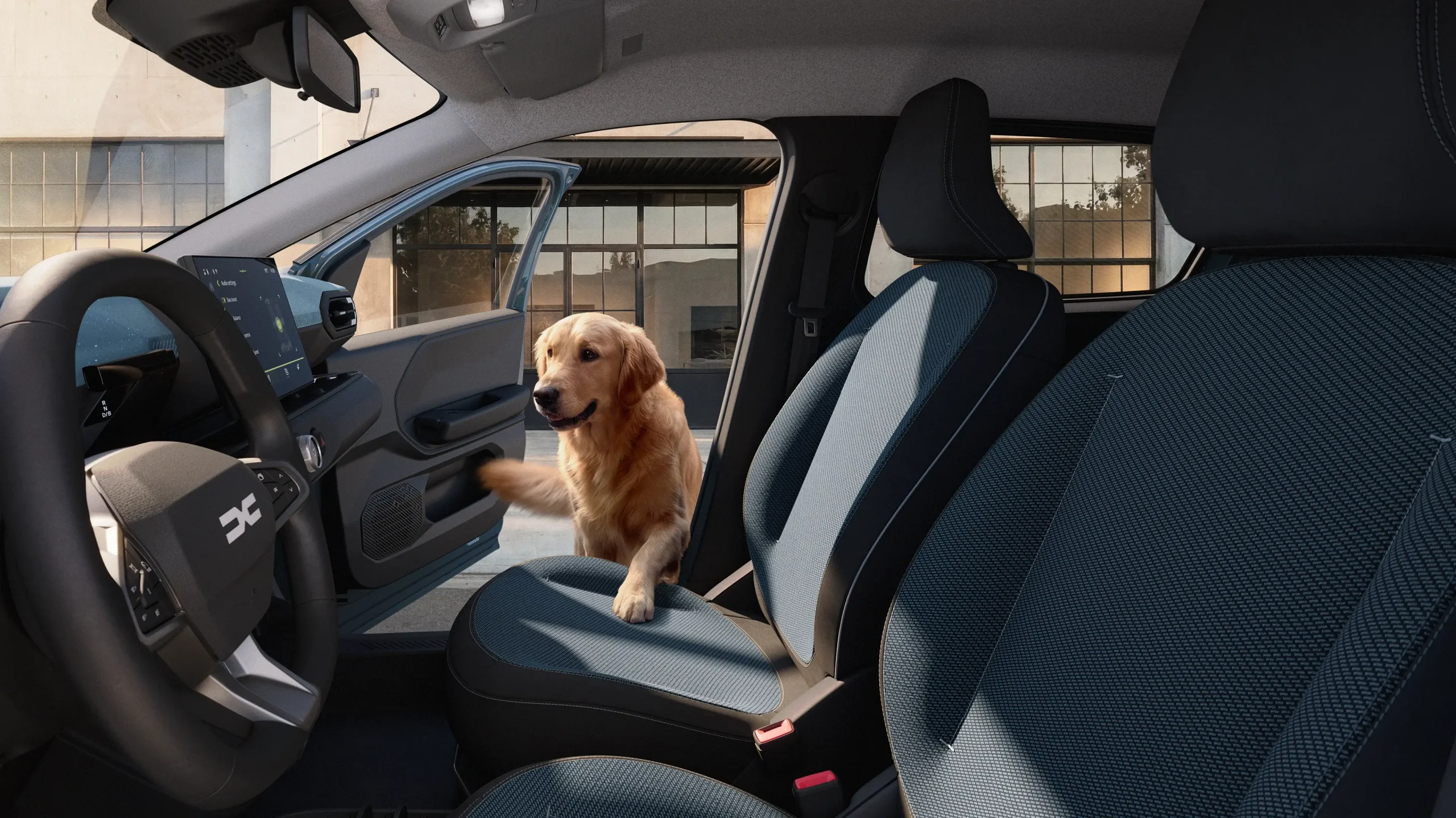 Vista interior do novo Dacia Spring com cão a entrar pela porta