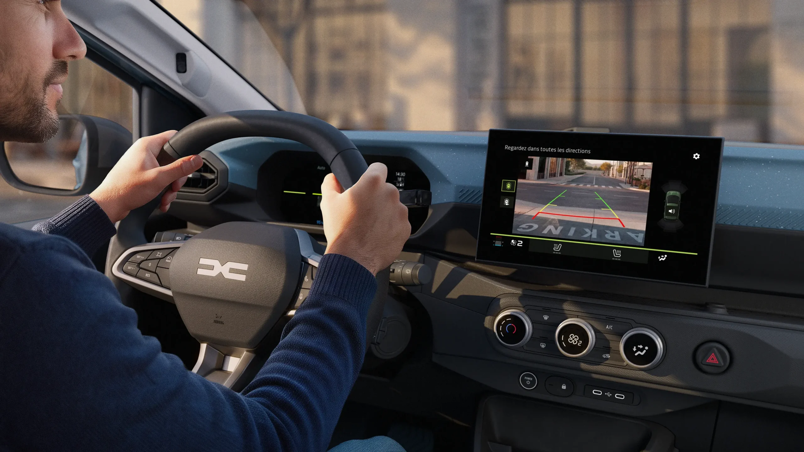 Vista interior do novo Dacia Spring com sistemas de ajuda de estacionamento