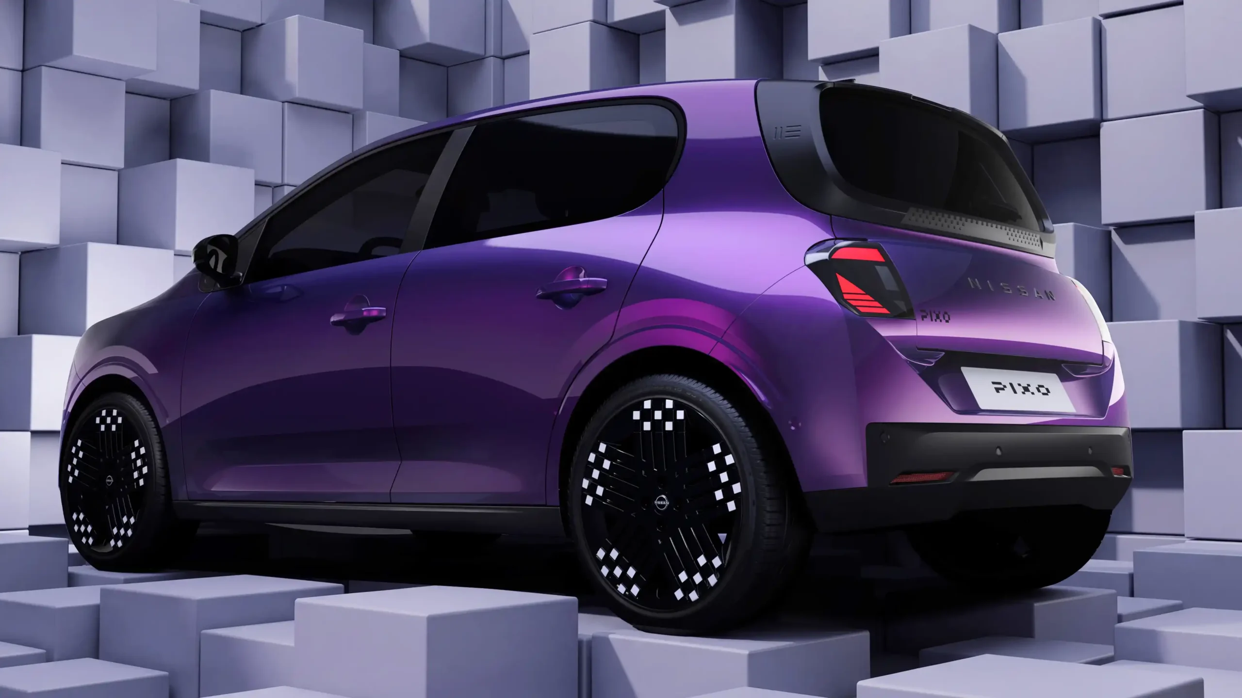 Nissan PIXO visto de traseira num cenário com cubos